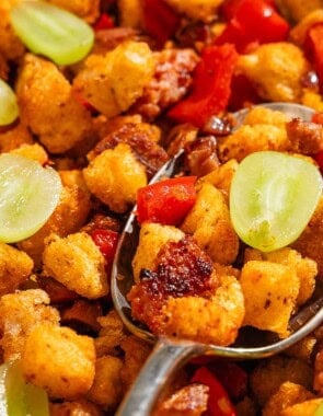 A close up of migas with a spoon.