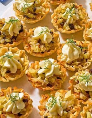 Several phyllo cups spread evenly on a platter.
